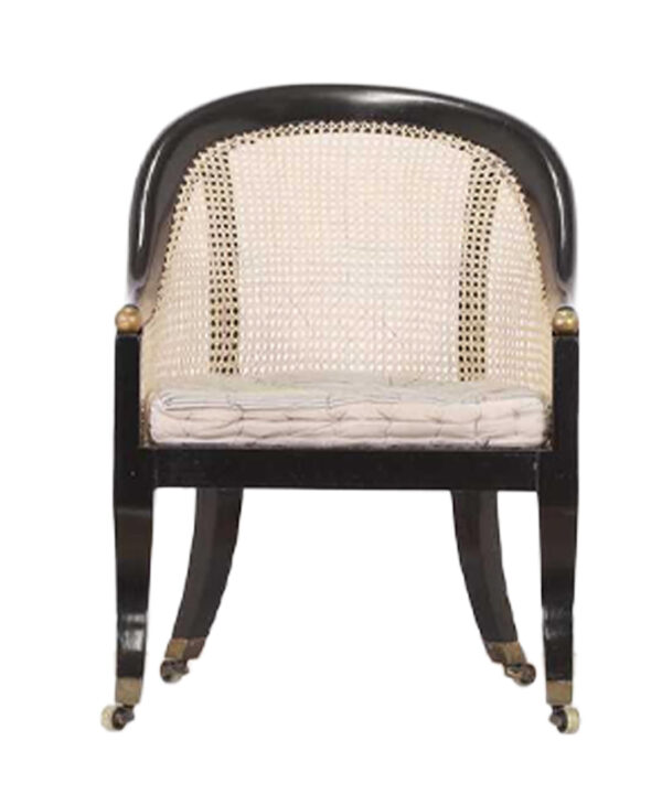 REGENCY EBONISED BERGÈRE LIBRARY ARMCHAIR ATTRIBUTED TO GILLOWS. CIRCA 1810.