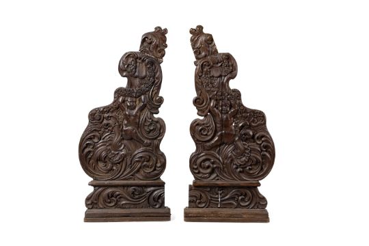 A PAIR OF C18th CARVED OAK PEW ENDS